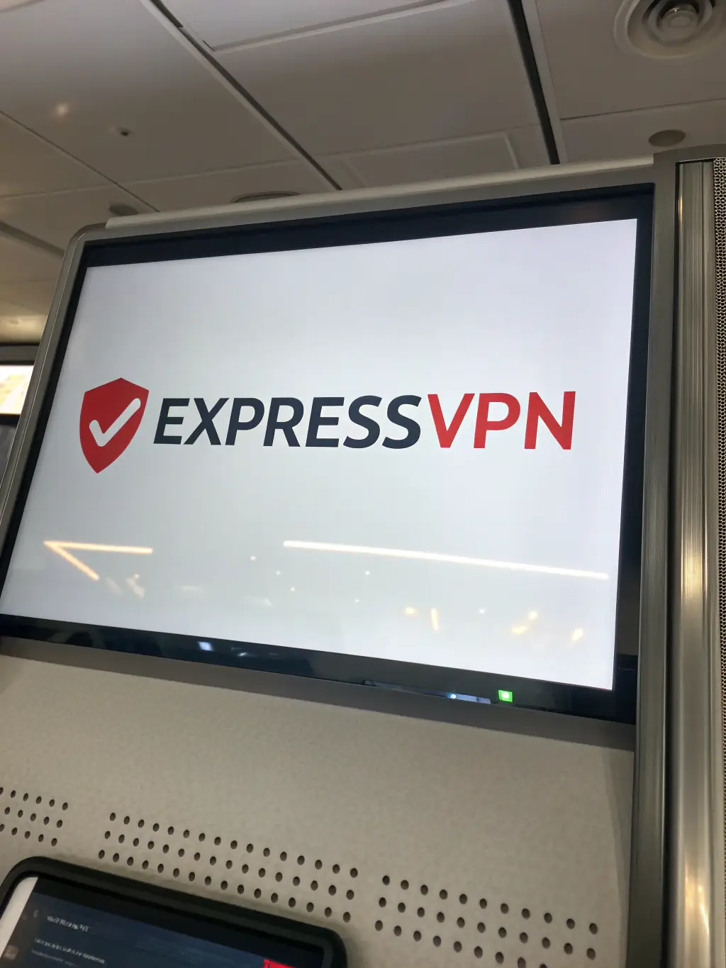 A clean, minimalist image of the ExpressVPN logo on a smartphone, highlighting its focus on speed and global server network, against a blurred cityscape.